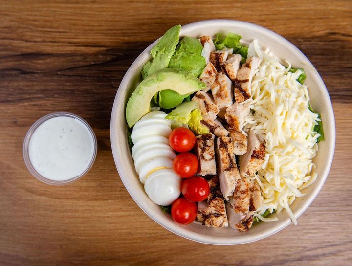 California Salad with grilled chicken, avocado, egg, and almonds