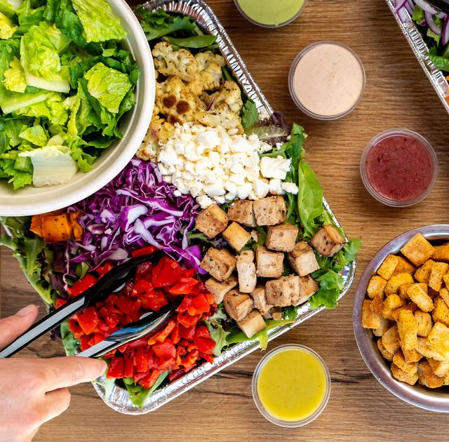 Salad House catering trays set up for a Chicago office lunch